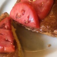 Welsh Rarebit · English farmhouse cheddar with mustard on toast, topped with fresh tomatoes. 