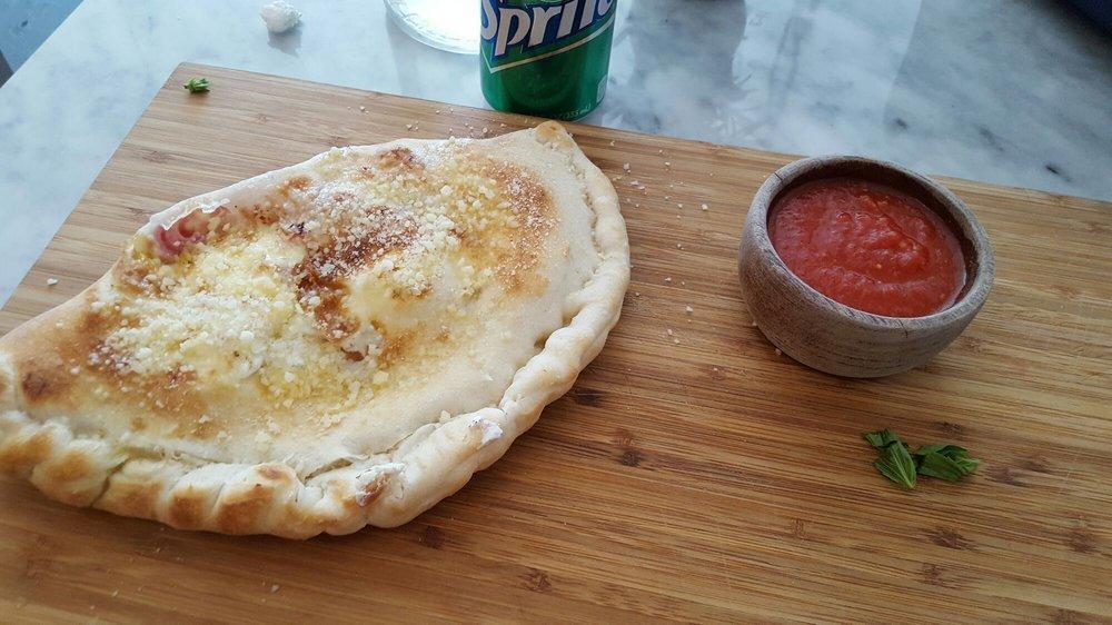 Calzone · Stuffed with mozzarella cheese, soppressata or ham and ricotta cheese.