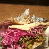 Popeye Delight Sandwich · Spinach and mushroom falafel, hummus, fresh spinach, red cabbage and tahini.