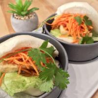 2 Piece Asian Steamed Buns · Asian steamed bun filled generously with your choice of our savory ingredients.