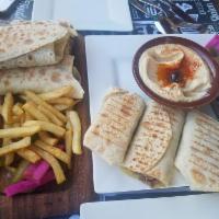 Kofta Kabab Wrap · Mix of minced lean lamb and veal meat cooked on the grill and topped with sumak, with a mix ...