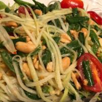 Green Papaya Salad · Papaya, tomatoes, peanuts and long beans with chili lime juice. Medium spicy.
