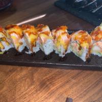 Warriors Roll · Shrimp tempura, avocado, crab topped with seared salmon with mango and unagi sauce.