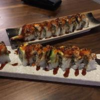 Dragon Roll · Shrimp tempura, cucumber, topped with eel, avocado and tobiko.