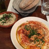 Chicken Hummus · Topped with tender chunks of chicken, paprika, parsley and extra virgin olive oil. Gluten fr...