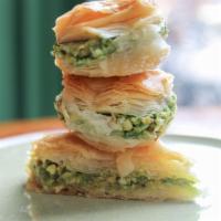 Baklava · Pastry made of layers of filo dough, filled with chopped walnuts and pistachios and sweetene...