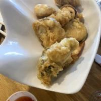 Tempura · Four pieces of deep fried shrimp and vegetables.