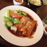Enchiladas · 2 red or green enchiladas with meat choice and melted cheese.