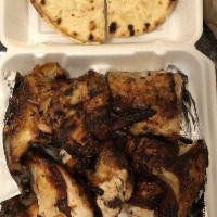 03- 1 Full Pork Ribs 1 Whole Chickens with 2 Side Orders and Pita Family Meal · 