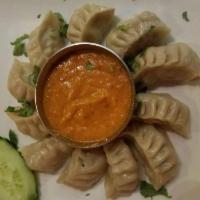 Chicken Momos · Authentic Nepalese dumplings. Steamed or fried. Served with himchuli sauce.