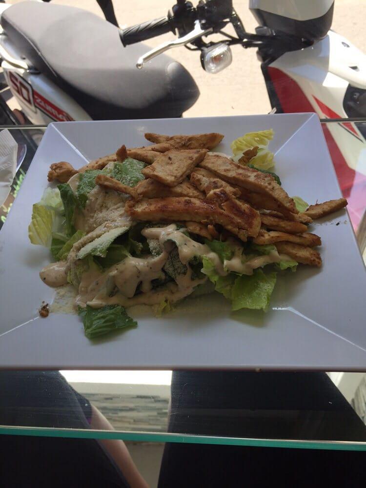 Chicken Caesar Wrap · Romaine lettuce, grilled chicken and Parmesan cheese with Caesar dressing. 