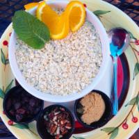 Oatmeal · A bowl of our steel cut Oatmeal with side brown sugar, raisins, sliced almonds & a cup of Se...