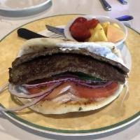Gyro Sandwich Lunch · Lamb gyro, with tomatoes, red onion and a cucumber tzatziki rolled in grilled pita bread.