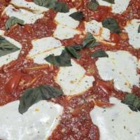 Margherita Pizza · Chunky tomato, fresh mozzarella, basil and extra virgin olive oil.