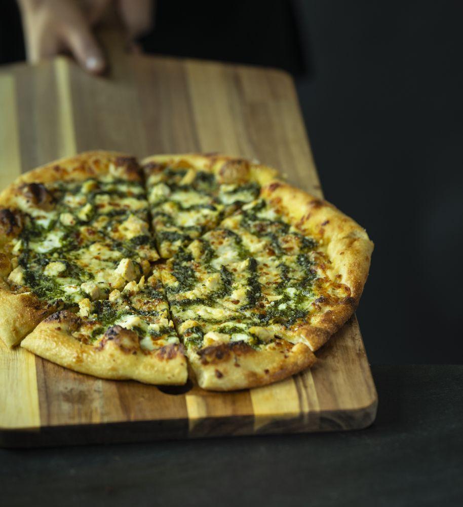 Pesto Chicken Pizza · Herbed olive oil, fresh mozzarella, chicken, pesto, and spin blend cheese.