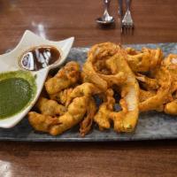 Onion Bhaji · Thinly sliced onions fried and chickpea batter.
