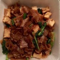 Pad See Ew Noodles · Pan fried flat rice noodles with egg, Chinese broccoli, meat and soy sauce.