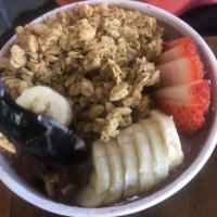 The Nutty Bowl · Acai Blended with Banana, Strawberries, Almond Butter, Cacao, Camu Camu, Maple Syrup & Almon...