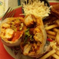 Buffalo Chicken Wrap · Buffalo chicken tenders with lettuce, tomato & cheddar cheese rolled in a flour wrapper with...