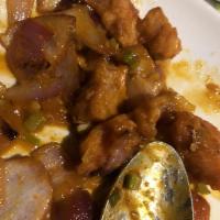 Chili Chicken · Lightly fried white meat chicken cubes with chili paste and fresh onions.