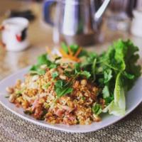 Nam Khao · Crispy rice salad-prepared with rice, curry paste, pork, cured pork, coconut, peanuts, green...