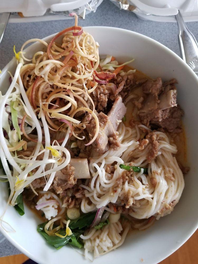 Khao Poon · Vermicelli rice noodles in a pork red curry broth. Served with fresh vegetables.