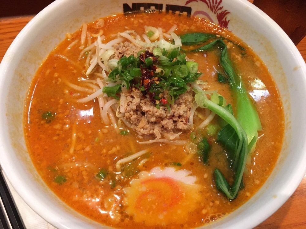 Tan Tan Ramen · Spicy sesame based broth with bean sprouts, scallion, bok choy, fishcake, and ground pork. Topped with our homemade chili oil.