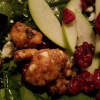 State Salad · Baby spinach, green apple, candied walnuts, dried cranberries, gorgonzola, red onion, champa...