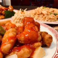 Sweet and Sour Chicken · Served with choice of rice and an eggroll.