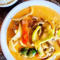 Panang Curry · Rich red curry with coconut milk, bell pepper, white onion, and kafir lime leaves.
