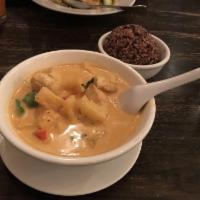 Pineapple Curry · Coconut milk in red curry, pineapple, bell pepper, and Thai basil.