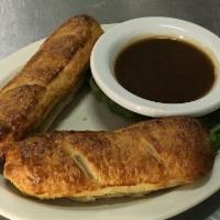 Sausage Rolls · Spiced ground sausage wrapped in puff pastry and baked to perfection. Served with brown gravy.