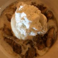 Hot Apple Crisp · Topped with vanilla ice cream and whipped cream.