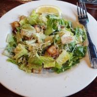 Caesar Salad · Crisp romaine, aged Parmesan cheese and garlic croutons tossed with traditional Caesar dress...