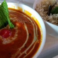 Butter Chicken · Cooked in creamy tomato buttery sauce.