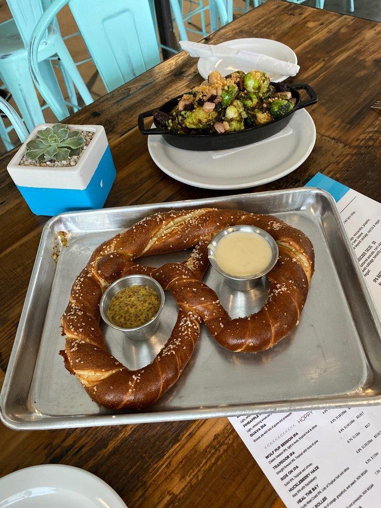 Pub Pretzel · Giant Bavarian pretzel served with IPA beer cheese and spicy mustard. Substitute served with pimento beer cheese (vegan) upon request.