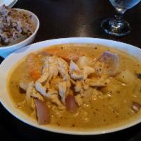 Yellow Curry · Mild and a hint of sweetness from palm sugar, potato, carrot and red onion. Spicy. Served wi...