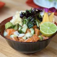Salmon Poke Bowl · The Salmon Poke Bowl contains rice and mixed greens. It contains 2 scoops of raw salmon poke...