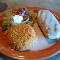 Chimichanga · A large flour tortilla stuffed with your choice of ground beef or shredded chicken, and refr...