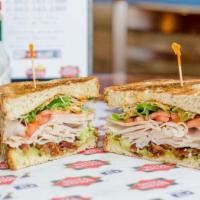 Santa Fe Club Sandwich · Turkey, bacon, avocado, lettuce, tomato, sprouts and chipotle mayo served on toasted multi-g...
