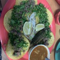 Mini Tacos · 5 beef mini tacos in corn tortillas. Served with cilantro, grilled onions, grilled jalapeno,...