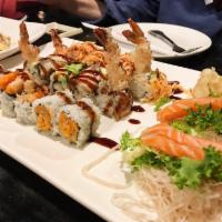 2014 Roll · Shrimp tempura, spicy tuna, avocado inside, topped with spicy crabmeat and chefs special sau...
