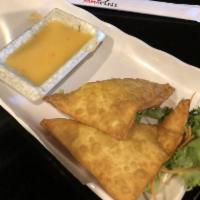 6 Pieces Crab Rangoon · Crab meat with cream cheese wrapped in crispy wonton skin.