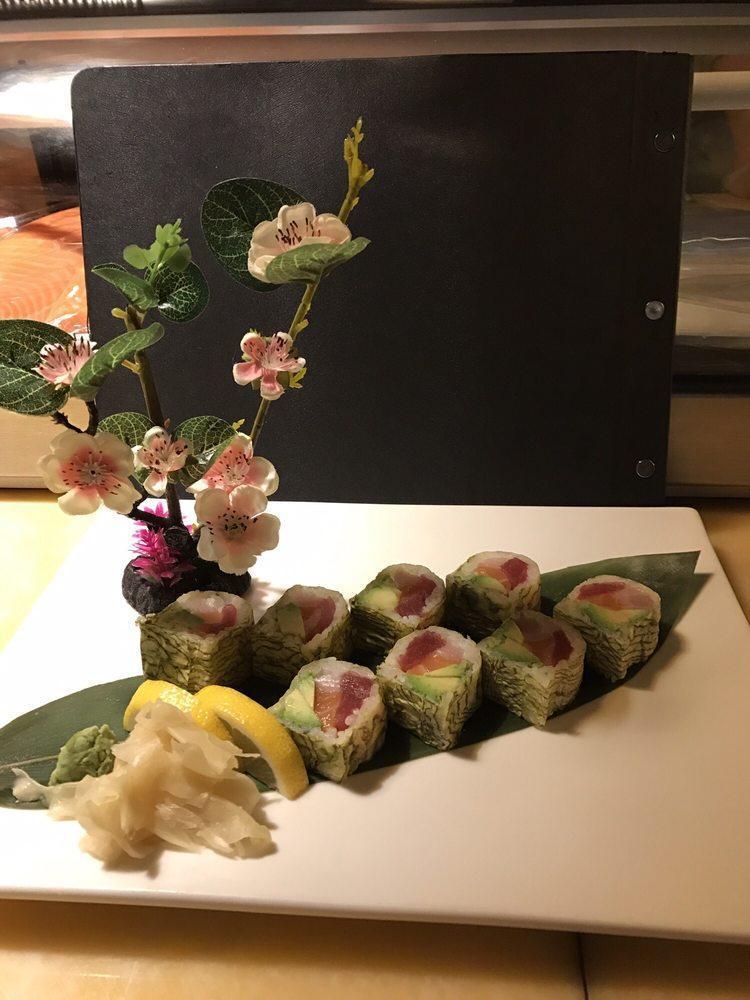 Fantastic Roll · Fresh tuna, salmon, yellowtail, avocado and tobiko wrapped in white seaweed paper. Uncooked.