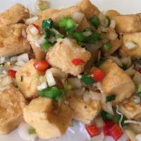 Salt and Pepper Tofu · Deep fried tofu tossed with ginger, garlic, onions and bell pepper in a salty and spicy dry ...