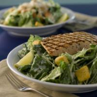 Grilled Salmon Caesar Salad · Grilled wild Alaska fillet served on side of Caesar salad with croutons, cheeses and Caesar ...