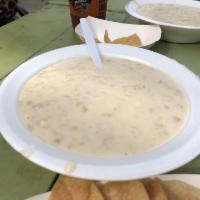 New England Clam Chowder · New England style clam chowder, served with oyster crackers.