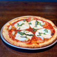 Margherita Pizza · Fresh mozzarella, tomatoes, roasted garlic, fresh basil. Vegetarian.