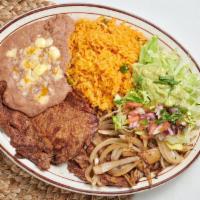 Carne Asada · Thinly sliced ribeye steak with grilled onions. Served with rice, beans, tortillas, and guac...