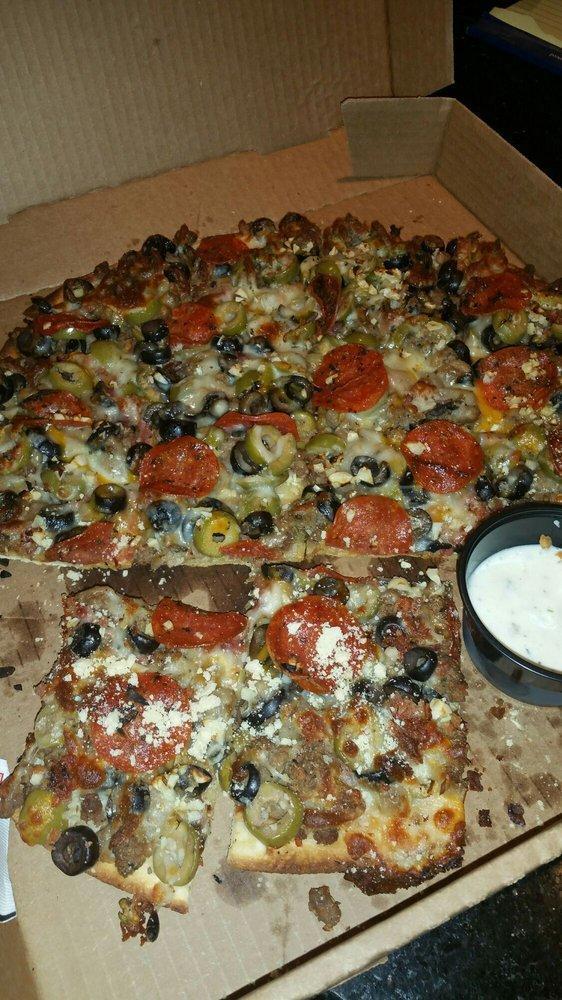 Meat Lover Pizza · Canadian bacon, pepperoni, sausage, ground beef and bacon.